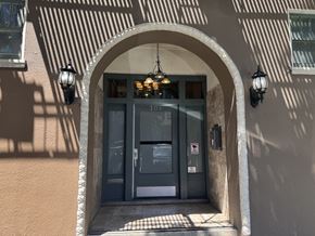 San Francisco apartment for rent - The image shows a building entrance with a glass door and a sign that reads "106".