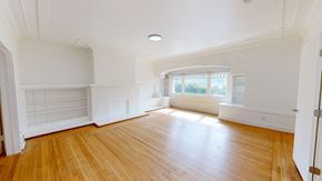 San Francisco apartment for rent - A room with wooden floors and white walls.