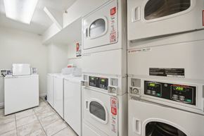 San Francisco apartment for rent - Laundry room with washing machines neatly arranged on a wooden floor