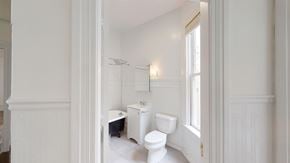 San Francisco apartment for rent - A white bathroom with a toilet, sink, and shower.
