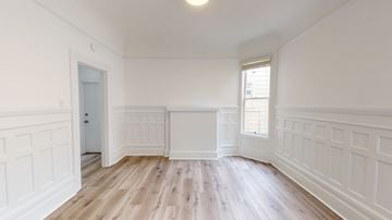 San Francisco apartment for rent - A room with white walls and wooden flooring.