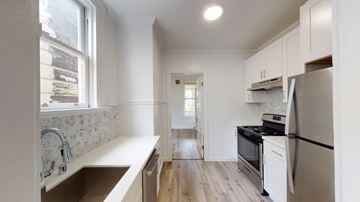 San Francisco apartment for rent - A kitchen with a refrigerator, sink, and oven.