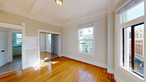 San Francisco apartment for rent - A room with wooden floors and white walls.
