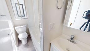 San Francisco apartment for rent - A white bathroom with a toilet and sink.