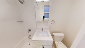 San Francisco apartment for rent - A white bathroom with a sink, toilet and bathtub.