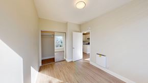 San Francisco apartment for rent - A room with a white wall and a wooden floor.