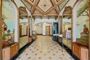 San Francisco apartment for rent - A hallway with a mural of a man playing guitar on the wall.