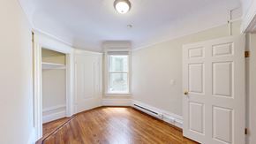 San Francisco apartment for rent - A room with a wooden floor and white walls.