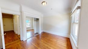 San Francisco apartment for rent - A room with wooden floors and white walls.