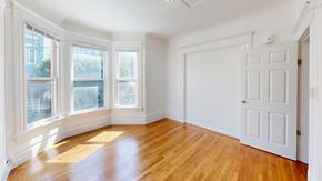 San Francisco apartment for rent - A room with wooden floors and white walls.