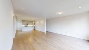 San Francisco apartment for rent - A large empty room with wooden floors and white walls.