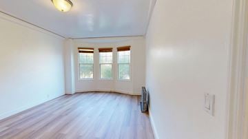 San Francisco apartment for rent - A room with a window and a door.