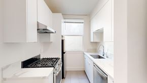 San Francisco apartment for rent - A white kitchen with a stove top oven and a dishwasher.