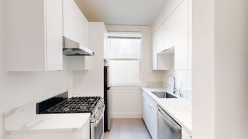 San Francisco apartment for rent - A white kitchen with a stove top oven and a dishwasher.