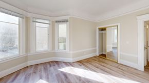 San Francisco apartment for rent - A room with a wooden floor and white walls.