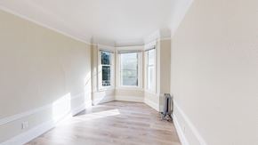 San Francisco apartment for rent - A room with a window and a vacuum cleaner.