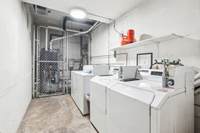 San Francisco apartment for rent - Laundry room with a row of washing machines and dryers