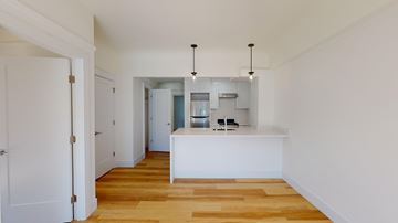 San Francisco apartment for rent - A kitchen area with a white counter and cabinets.