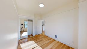 San Francisco apartment for rent - A room with wooden floors and white walls.