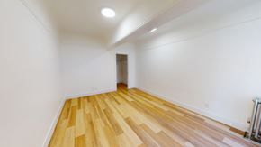 San Francisco apartment for rent - A room with wooden flooring and white walls.
