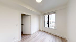 San Francisco apartment for rent - A room with a white door and a window with a view of a balcony.