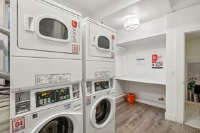San Francisco apartment for rent - Laundry room with washing machines neatly arranged on a wooden floor