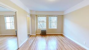 San Francisco apartment for rent - A room with wooden floors and a radiator.