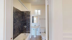 San Francisco apartment for rent - A bathroom with a white toilet, sink, and bathtub.