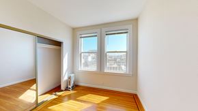 San Francisco apartment for rent - A room with a sliding glass door and a window.