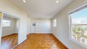 San Francisco apartment for rent - A room with wooden flooring and white walls.