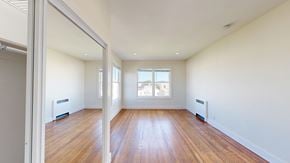 San Francisco apartment for rent - A room with wooden floors and white walls.
