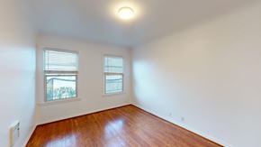 San Francisco apartment for rent - A room with wooden floors and two windows.