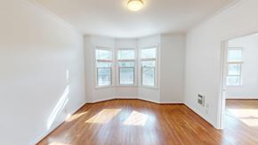 San Francisco apartment for rent - A room with wooden floors and white walls.
