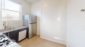 San Francisco apartment for rent - A kitchen with a stove, sink, and refrigerator.