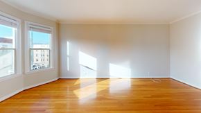 San Francisco apartment for rent - A room with wooden floors and white walls.