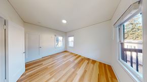 Berkeley apartment for rent - A room with wooden floors and white walls.