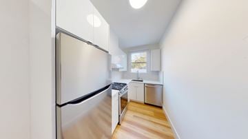Berkeley apartment for rent - A kitchen with a refrigerator, sink, and stove.