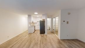 Berkeley apartment for rent - A kitchen with a refrigerator, sink, and cabinets.