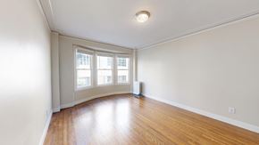 San Francisco apartment for rent - A room with a window and a fan.