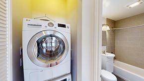 San Francisco apartment for rent - A white LG washing machine in a small bathroom.