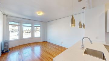 San Francisco apartment for rent - A kitchen with a white counter top and a window.