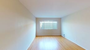 San Francisco apartment for rent - A room with a window and wooden floor.