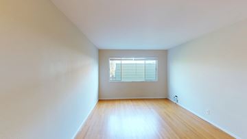 San Francisco apartment for rent - A room with a window and wooden floor.