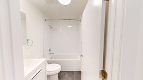 San Francisco apartment for rent - A white bathroom with a toilet, sink, and bathtub.