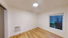 San Francisco apartment for rent - A room with a window and a wooden floor.