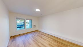 San Francisco apartment for rent - A room with a window and wooden flooring.