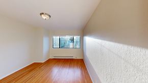 San Francisco apartment for rent - A room with a window and a radiator on the wall.