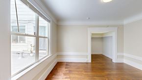 San Francisco apartment for rent - A room with a window and wooden floors.