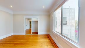 San Francisco apartment for rent - A room with wooden floors and white walls.