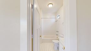 San Francisco apartment for rent - A white bathroom with a toilet, sink and bathtub.